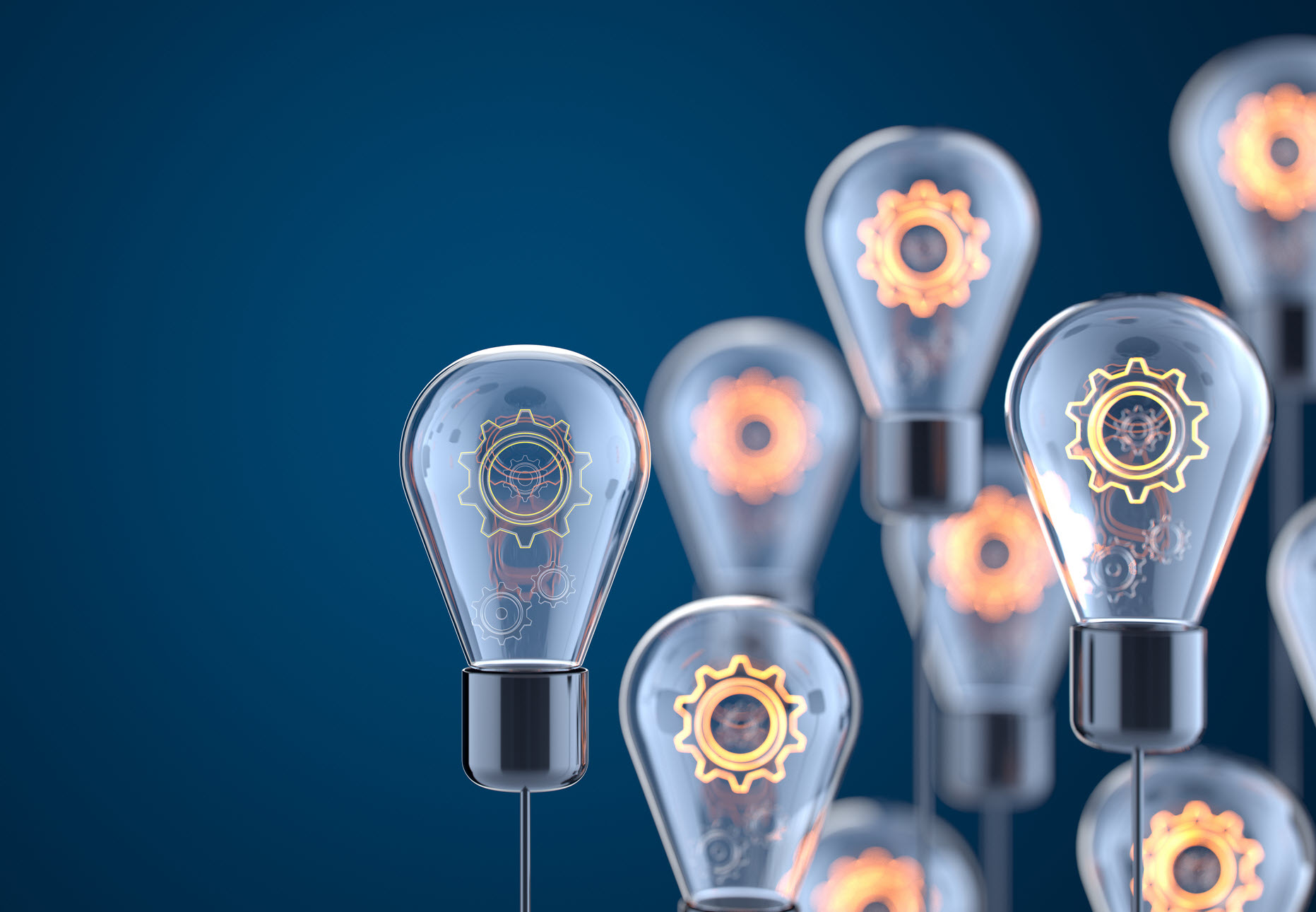 gears inside lightbulbs with blue background