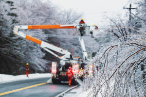 Linesman work to restore power during an intense winter storm.