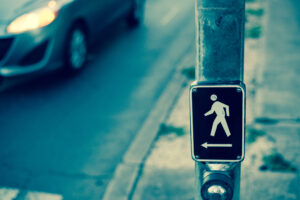 Crosswalk button with person walking icon