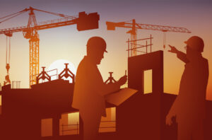 construction project manager discussing with subcontractor in front of large construction site with crane